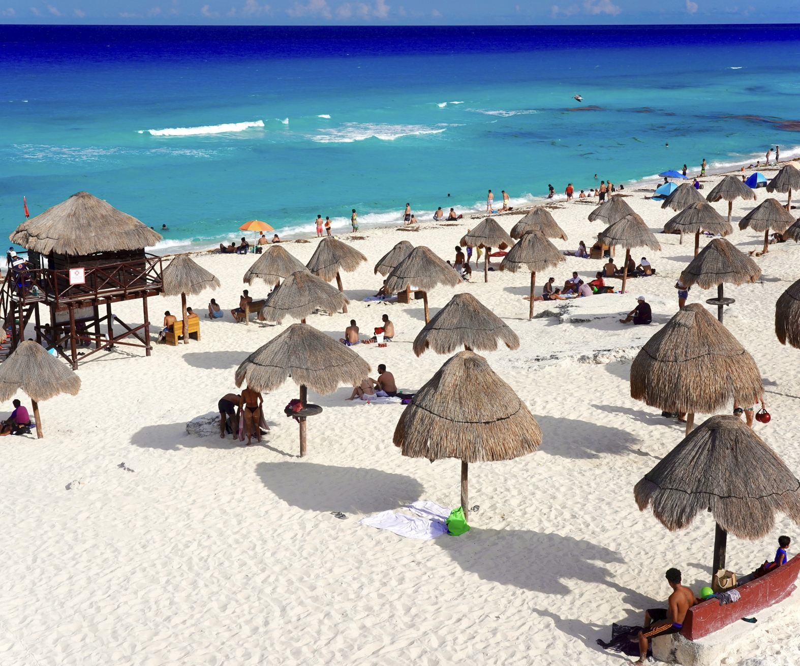 Turista de Cancún en la playa